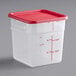 A translucent square plastic food storage container with a red lid.