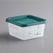 A Vigor translucent square plastic food storage container with a green lid.