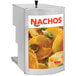 A Cretors nacho cheese peristaltic pump on a counter with a sign reading "Nachos" and a picture of nachos and jalapenos.