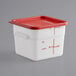 A white square plastic container with a red lid.