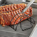 A rack of ribs on a Outset non-stick rib rack on a grill.