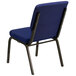 A navy blue church chair with white dot pattern on the seat.