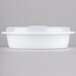 A white plastic Pactiv Newspring VERSAtainer container with a lid.