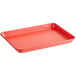 A red rectangular Baker's Mark aluminum tray with a wire rim.