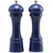 Two blue salt and pepper mills with a white top.