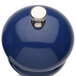 A cobalt blue pepper mill and salt mill set with silver knobs.