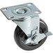 A black Cooking Performance Group swivel plate caster with silver metal wheels.