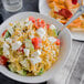 A bowl of Regal medium egg noodles with vegetables and feta cheese.
