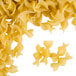 A pile of Regal medium egg noodles on a white background.