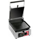 A black rectangular Sirman ELIO LL single panini grill with smooth plates and a black lid.