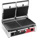 A Sirman double panini grill with two griddles on a table in a professional kitchen.