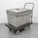 A grey plastic Vollrath Tote 'N Store chafer box on a cart.