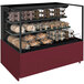 A Structural Concepts non-refrigerated self-service display case with bread and rolls on two shelves.
