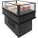 A black Structural Concepts refrigerated mobile island air curtain merchandiser with food inside.