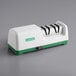 A white and green Garde electric knife sharpener.