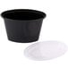 A black plastic Newspring Ellipso souffle container with a clear plastic lid.