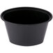 A black plastic oval souffle container with a black lid.