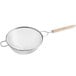 A Vollrath stainless steel medium mesh strainer with a wooden handle.