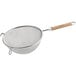 A Vollrath stainless steel double mesh strainer with a wood handle.