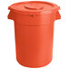 An orange plastic round ingredient storage bin with lid.