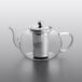 A clear glass teapot with a metal filter inside.