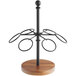 A black metal and acacia wood Tablecraft cone holder with round metal rings.