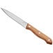 A Choice steak knife with a light brown wood handle.
