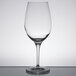 A Stolzle clear wine glass on a table.