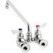 A silver Waterloo wall-mounted faucet with two silver handles and a 12" swing spout.