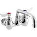 A chrome Waterloo wall-mounted faucet with two red handles.