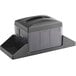 A black plastic OneUp by Choice tabletop napkin dispenser with a lid on top.