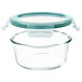 An OXO Good Grips clear round glass container with a leakproof snap-on lid.
