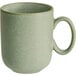 An Acopa Pangea sage matte porcelain mug with a handle.