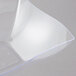 A clear plastic Fineline serving bowl with a curved edge in a plastic case.