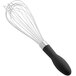 An OXO Good Grips black whisk with a black handle.