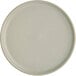 An Acopa Pangea white porcelain plate with a small rim.