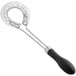 An OXO Good Grips wire whisk with a black rubber handle and metal wires.