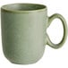 An Acopa Pangea sage matte porcelain cup with a handle.