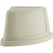 A beige plastic Lavex corner round trash can lid with a curved top.