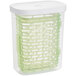 An OXO clear rectangular plastic container with green trays inside.