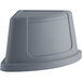 A Lavex grey plastic corner round trash can lid.