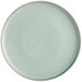 An Acopa Pangea Harbor Blue matte coupe porcelain plate with a white rim on a white background.