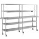 A stainless steel Regency expeditor table with double overshelf and two undershelves on wheels.
