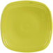 A Fiesta Lemongrass square china salad plate with a yellow rim.