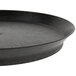 A black round deli server tray with a short black base.