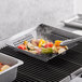 Mr. Bar-B-Q Non-Stick Perforated Grill Basket with food cooking on a grill.