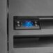 A digital temperature display on the side of a black Beverage-Air back bar refrigerator.
