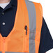 An orange Cordova high visibility safety vest with a zipper.