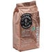 A brown bag of Lavazza Tierra Selection whole bean espresso coffee with a label.