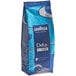 A close up of a blue Lavazza Dek Filtro decaf whole bean coffee bag with white text.